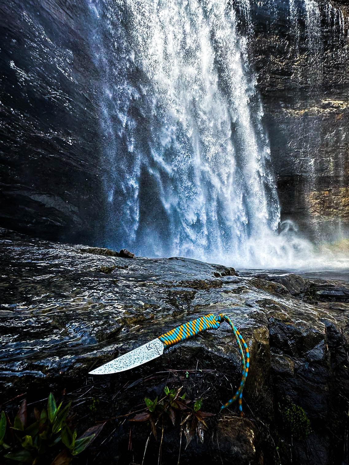 Lacey Knives 440c Outdoor Knife. The knife is wet from being on a rock near a waterfall